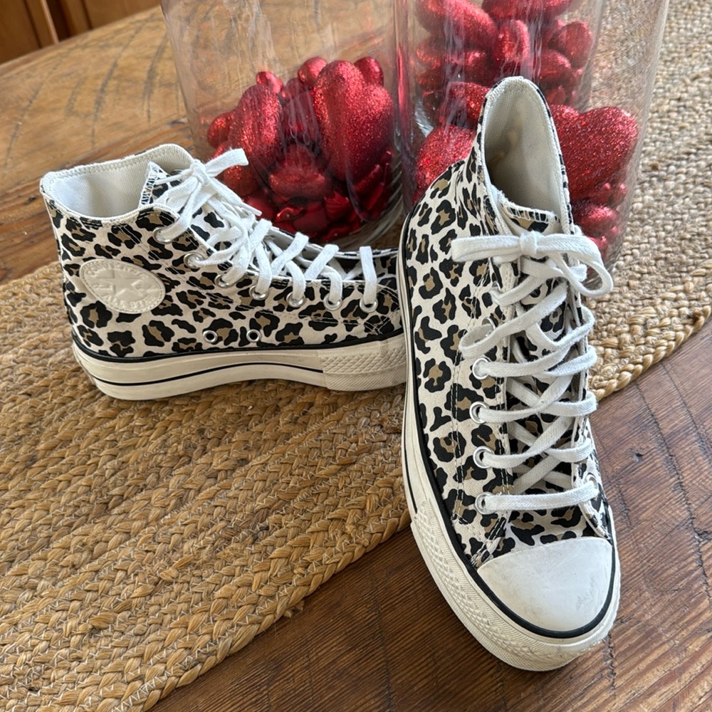 Hard to find Converse high top cheetah print platform tennis shoes.